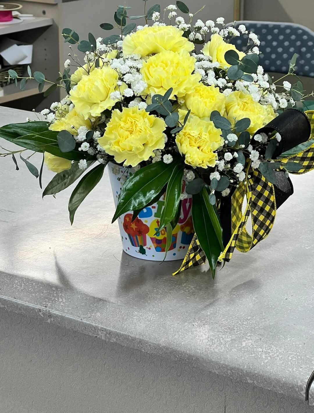 Yellow carnations in a mug